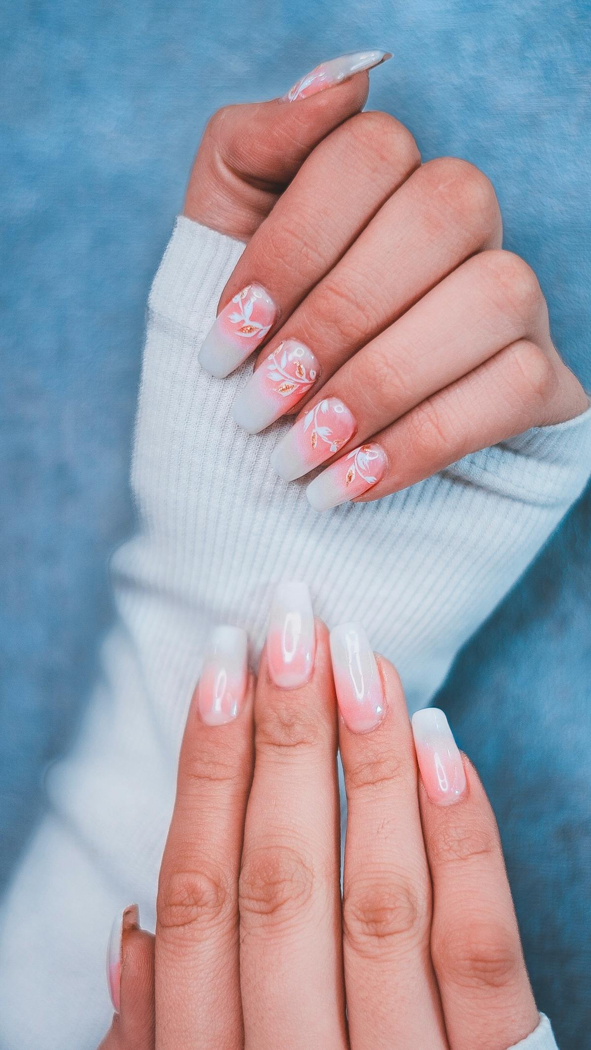 Long structured builder gel nails with delicate floral nail art